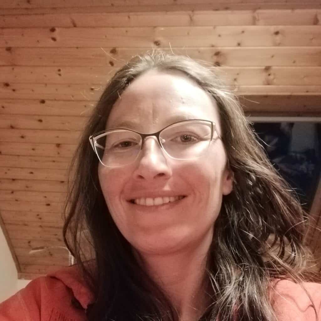 photo of the author, Helen Olivier. She is smiling into the camera.